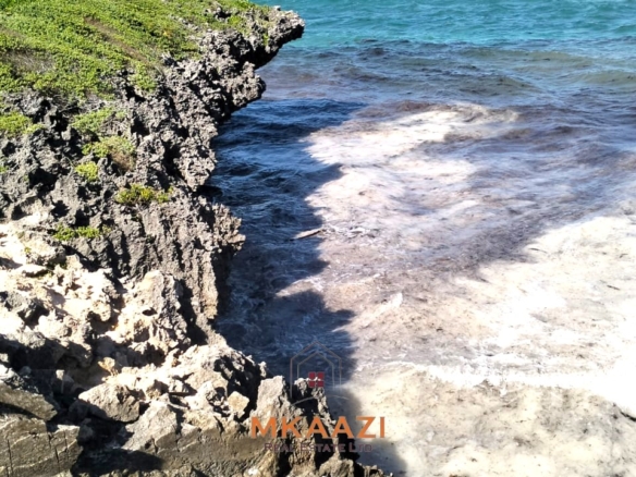 35-acre beachfront land for sale in Chumani featuring pristine white sandy beaches, panoramic ocean views, freehold title, and exceptional investment potential.