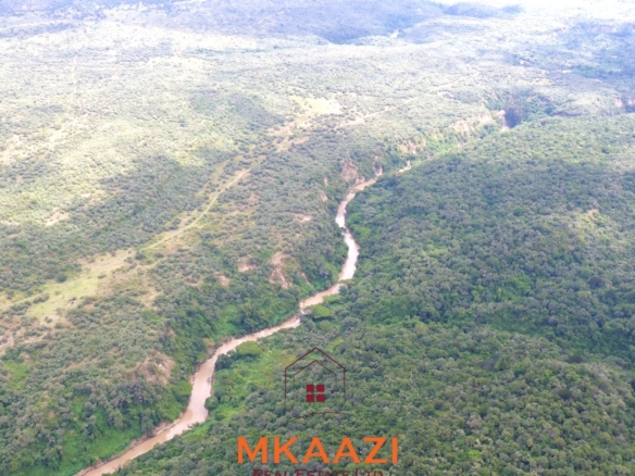 Luxury 1,800-acre ranch for sale in Naivasha featuring wildlife conservancy, river frontage, private airstrip, luxury cottages, and eco-tourism investment potential.