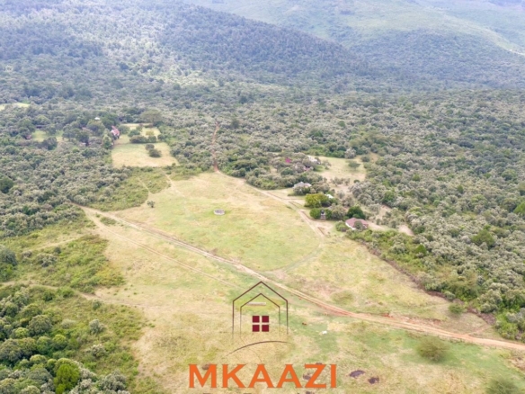 Luxury 1,800-acre ranch for sale in Naivasha featuring wildlife conservancy, river frontage, private airstrip, luxury cottages, and eco-tourism investment potential.
