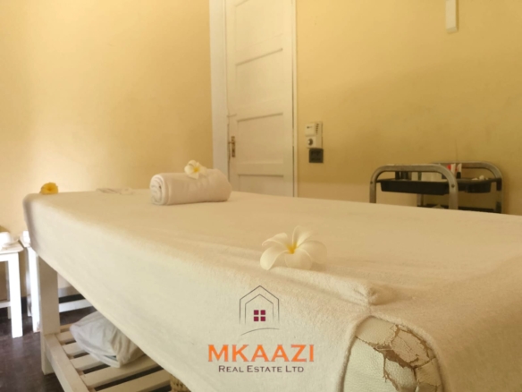 Luxury 2-bedroom apartment for sale at Mwembe Resort Malindi with pools, gym, spa, balcony, and resort amenities.