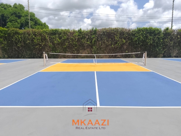 Luxury 2-bedroom apartment for sale at Mwembe Resort Malindi with pools, gym, spa, balcony, and resort amenities.
