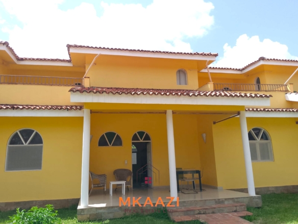 Luxury 2-bedroom apartment for sale at Mwembe Resort Malindi with pools, gym, spa, balcony, and resort amenities.