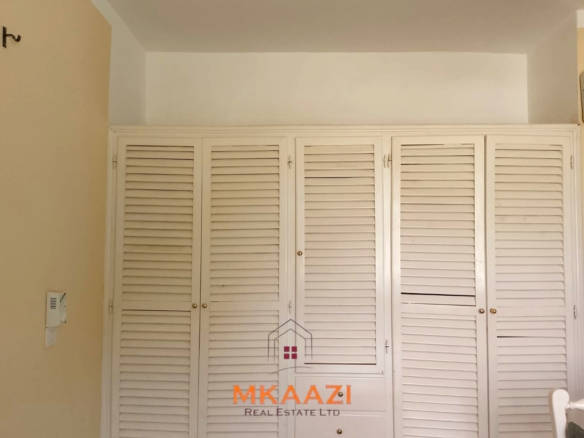 Luxury 2-bedroom apartment for sale at Mwembe Resort Malindi with pools, gym, spa, balcony, and resort amenities.