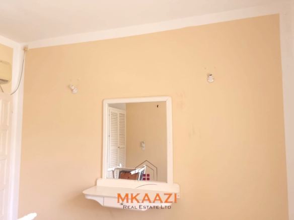 Luxury 2-bedroom apartment for sale at Mwembe Resort Malindi with pools, gym, spa, balcony, and resort amenities.