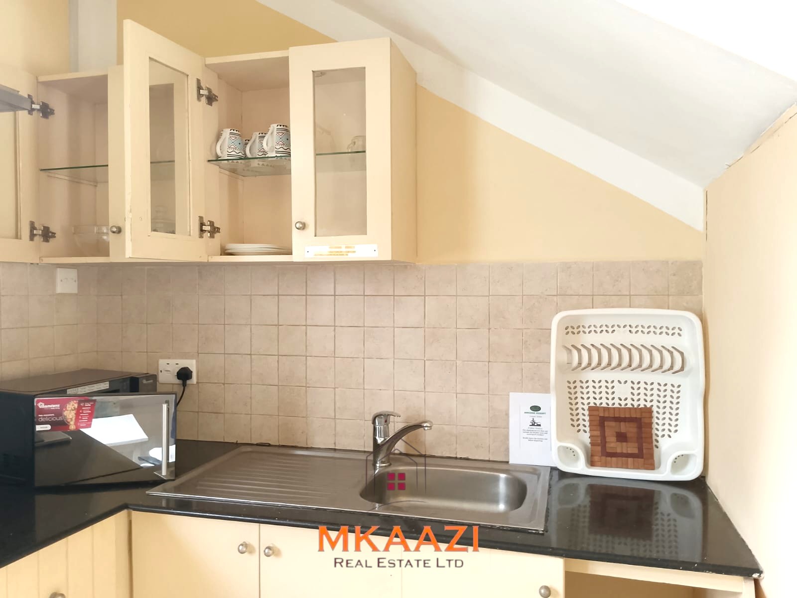 Luxury 2-bedroom apartment for sale at Mwembe Resort Malindi with pools, gym, spa, balcony, and resort amenities.