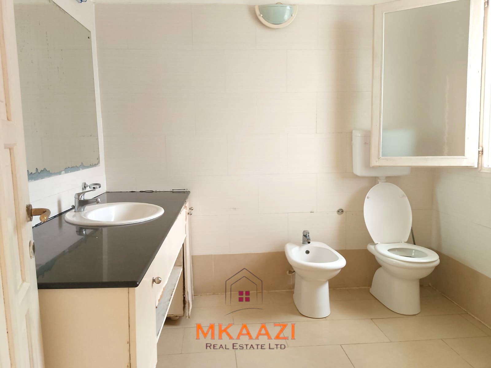 Luxury 2-bedroom apartment for sale at Mwembe Resort Malindi with pools, gym, spa, balcony, and resort amenities.