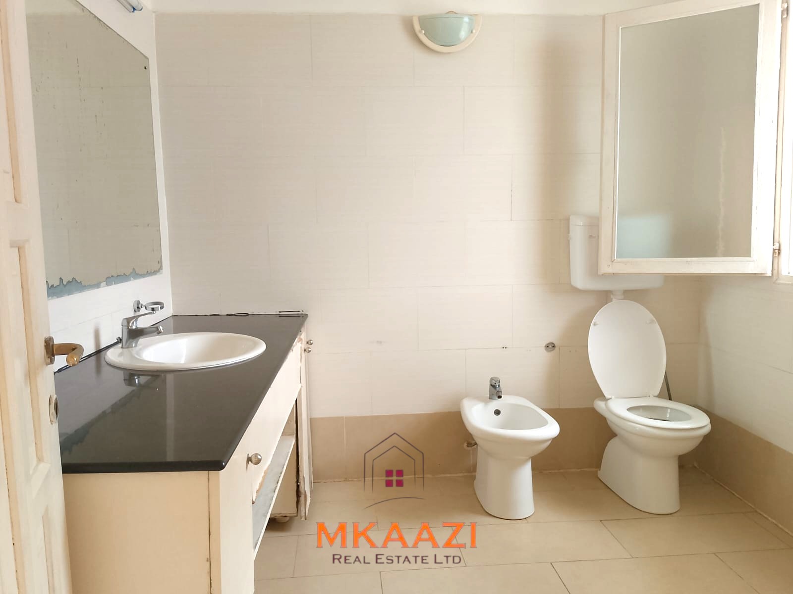 Luxury 2-bedroom apartment for sale at Mwembe Resort Malindi with pools, gym, spa, balcony, and resort amenities.