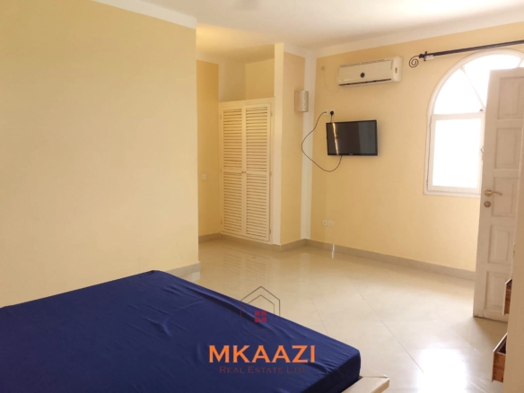 Luxury 2-bedroom apartment for sale at Mwembe Resort Malindi with pools, gym, spa, balcony, and resort amenities.