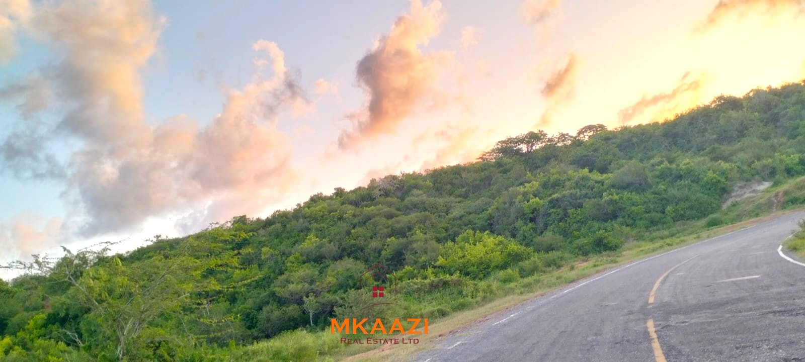 37 acres freehold cliffside road frontage land for sale at Marafa Bridge overlooking seasonal river and Marafa town ideal for agriculture, hospitality, and investment development.
