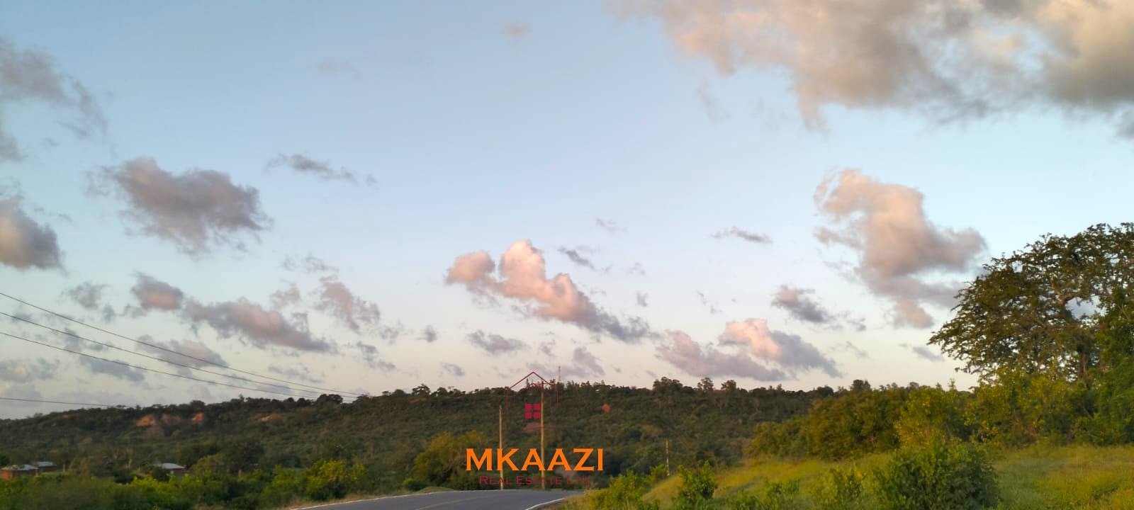 37 acres freehold cliffside road frontage land for sale at Marafa Bridge overlooking seasonal river and Marafa town ideal for agriculture, hospitality, and investment development.