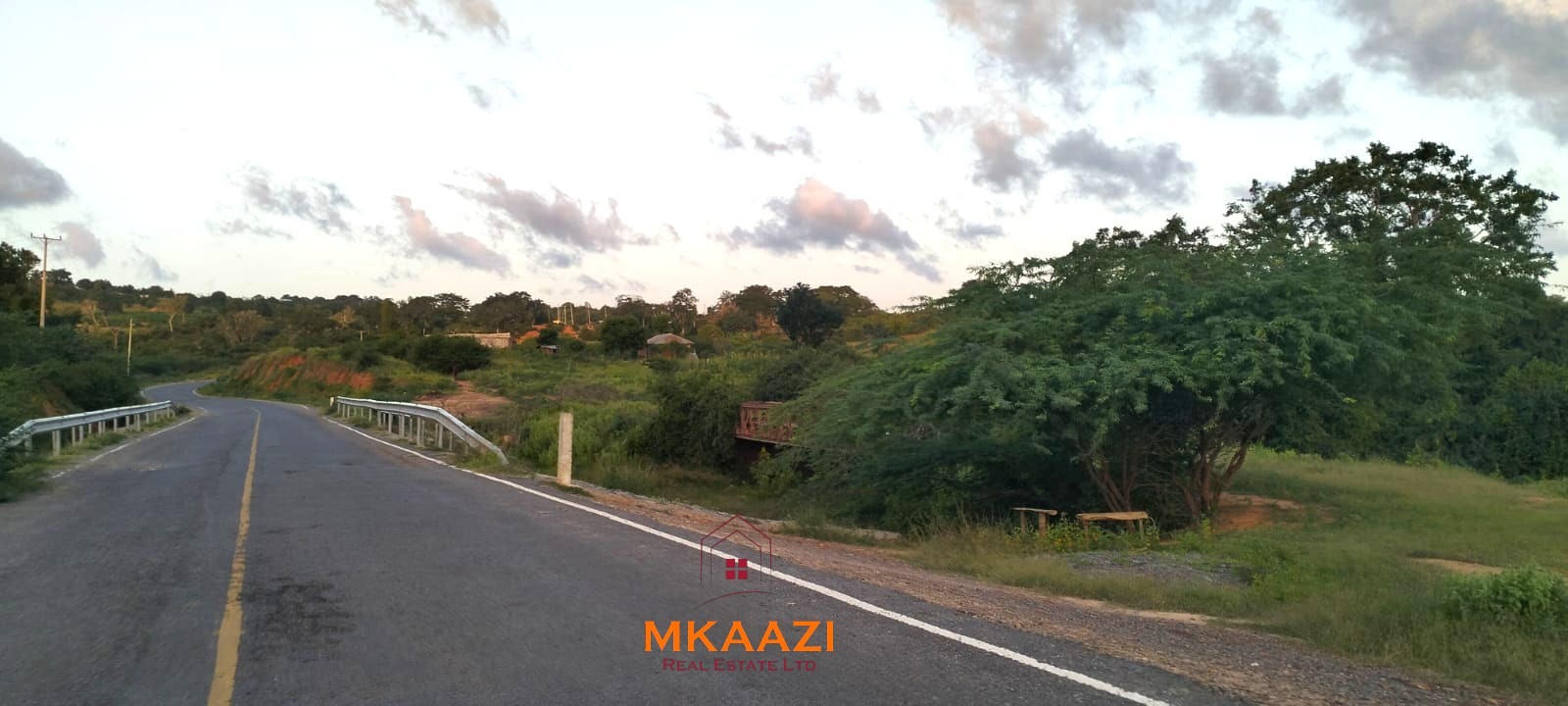 37 acres freehold cliffside road frontage land for sale at Marafa Bridge overlooking seasonal river and Marafa town ideal for agriculture, hospitality, and investment development.