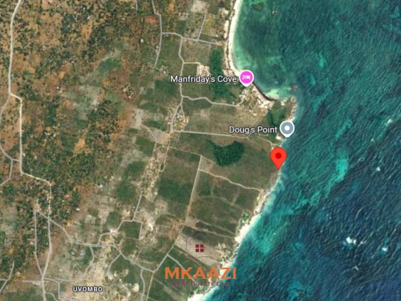 3-acre cliffside beachfront land for sale in Uyombo with sandy beach access and panoramic Indian Ocean views.