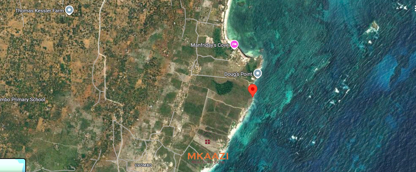 3-acre cliffside beachfront land for sale in Uyombo with sandy beach access and panoramic Indian Ocean views.