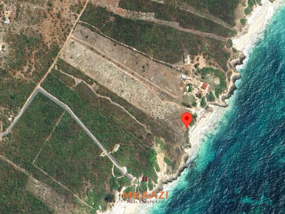 5-acre beachfront land for sale in Uyombo featuring sandy beachfront access, freehold title deed, coral bedrock foundation, and prime investment potential along Kenya’s North Coast.