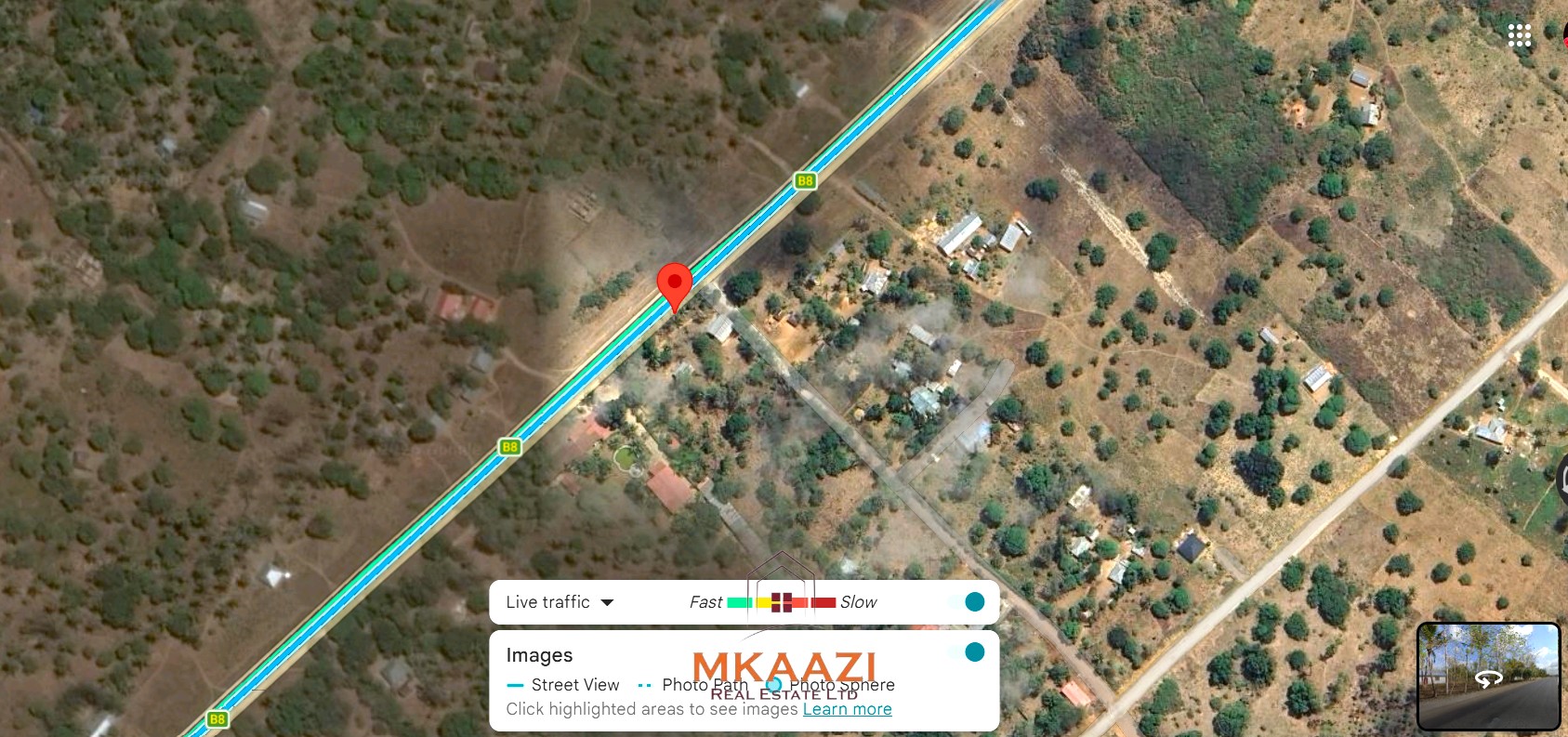 2-acre highway frontage property for sale in Matsangoni with house, shops, mature trees, and commercial investment potential.