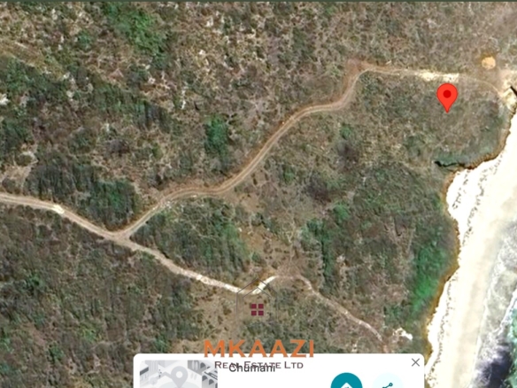 20-acre beachfront land for sale in Chumani featuring sandy beach access, gated and walled boundaries, coral bedrock foundation, and premium investment potential.