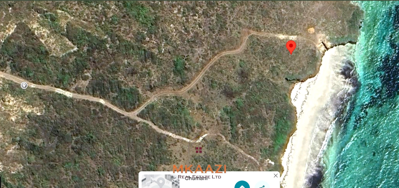 20-acre beachfront land for sale in Chumani featuring sandy beach access, gated and walled boundaries, coral bedrock foundation, and premium investment potential.