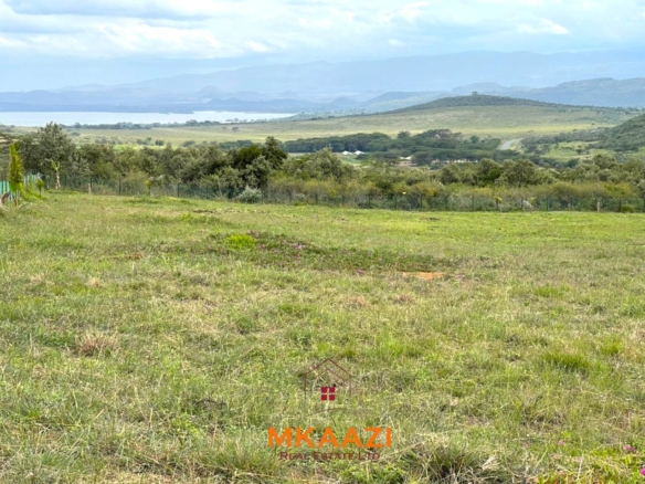 3-acre lake-view property in Malewa Bay Naivasha opposite Rift Valley Golf Club with ready title, fencing, piped water, and development potential.