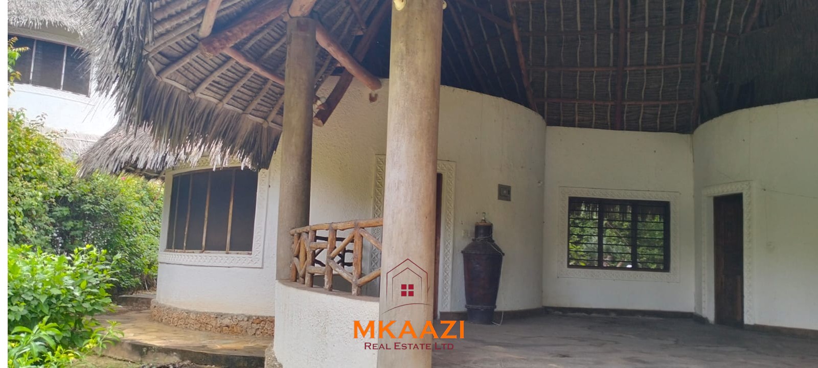 Luxury 4-bedroom house for sale in Mayungu, located in a secure gated community on the second row from the beach, featuring a shared swimming pool, landscaped garden, and serene coastal surroundings.