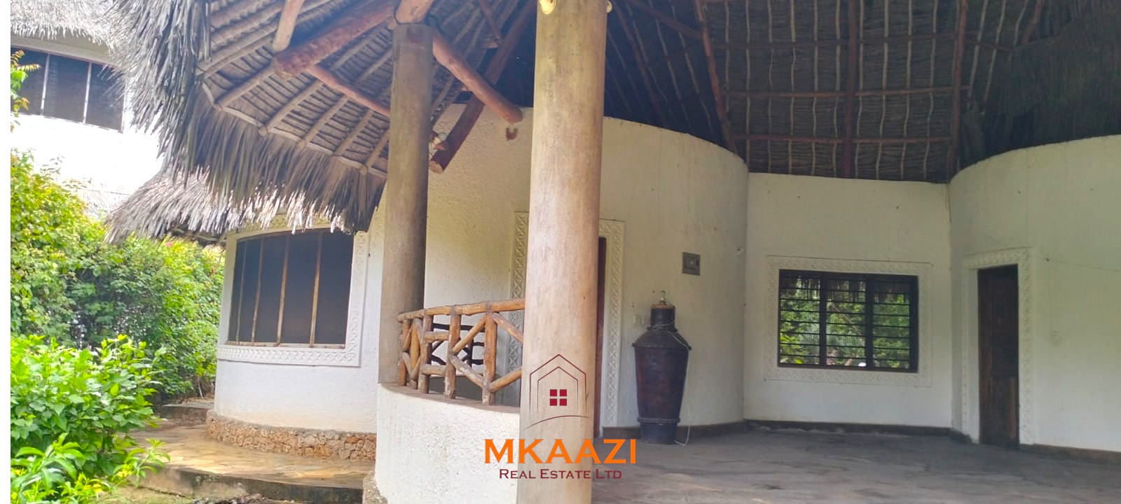 Luxury 4-bedroom house for sale in Mayungu, located in a secure gated community on the second row from the beach, featuring a shared swimming pool, landscaped garden, and serene coastal surroundings.