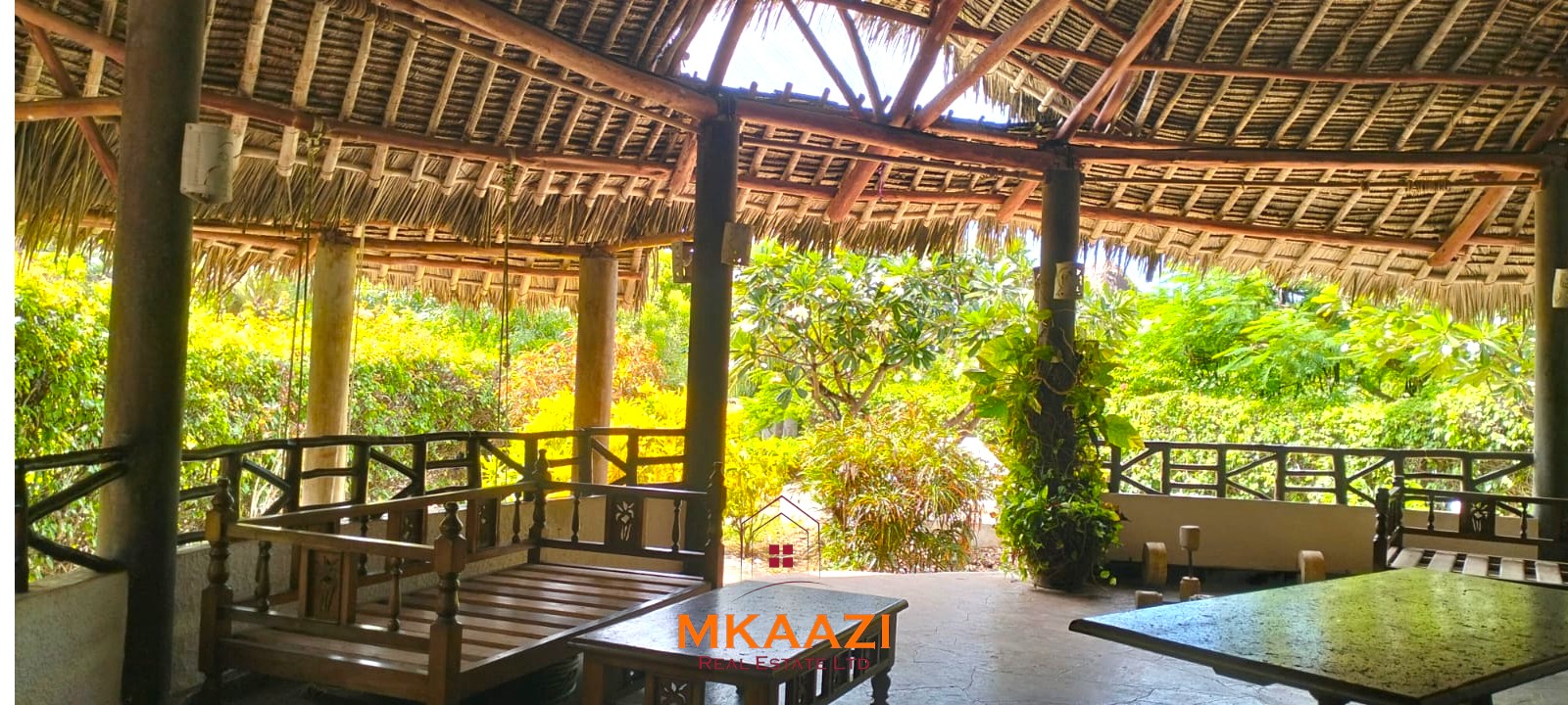 Luxury 4-bedroom house for sale in Mayungu, located in a secure gated community on the second row from the beach, featuring a shared swimming pool, landscaped garden, and serene coastal surroundings.