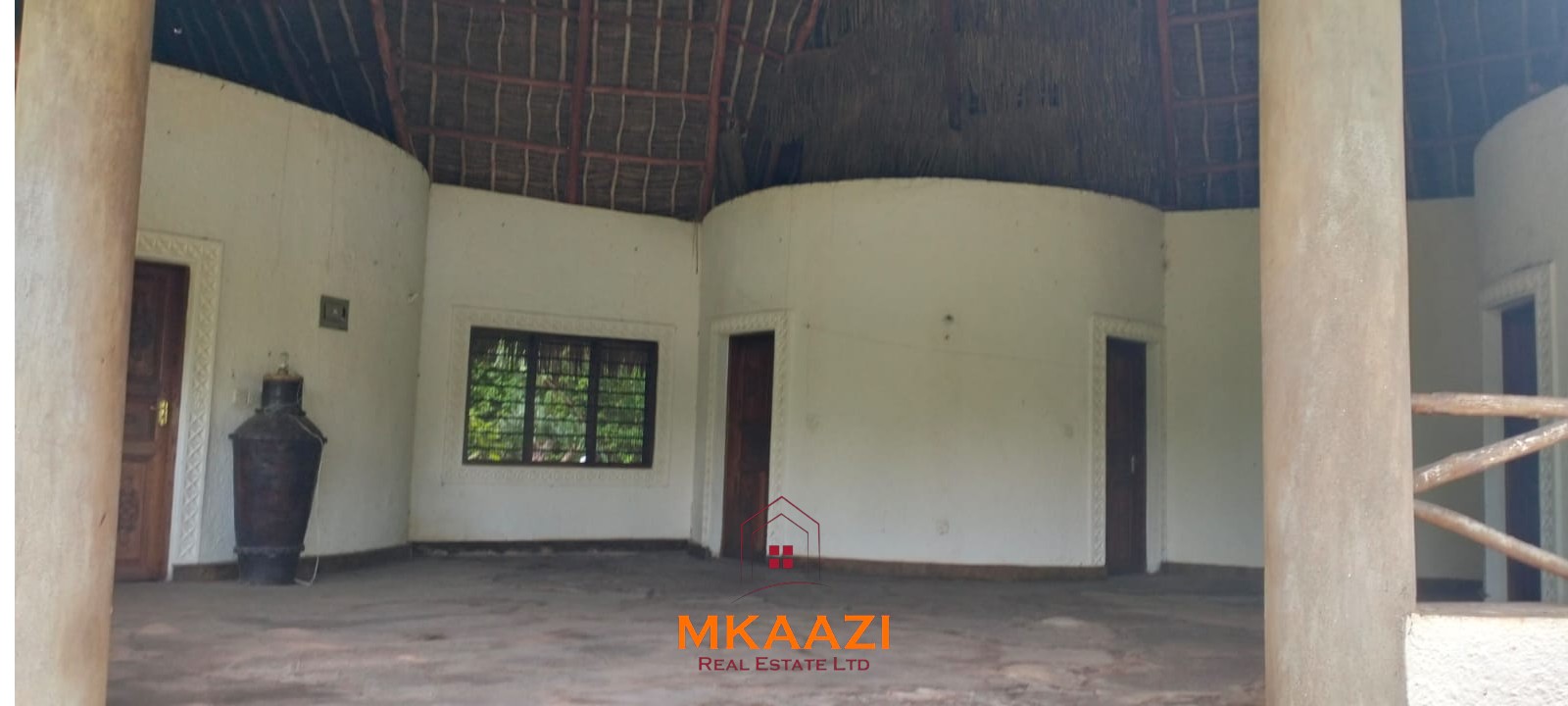 Luxury 4-bedroom house for sale in Mayungu, located in a secure gated community on the second row from the beach, featuring a shared swimming pool, landscaped garden, and serene coastal surroundings.