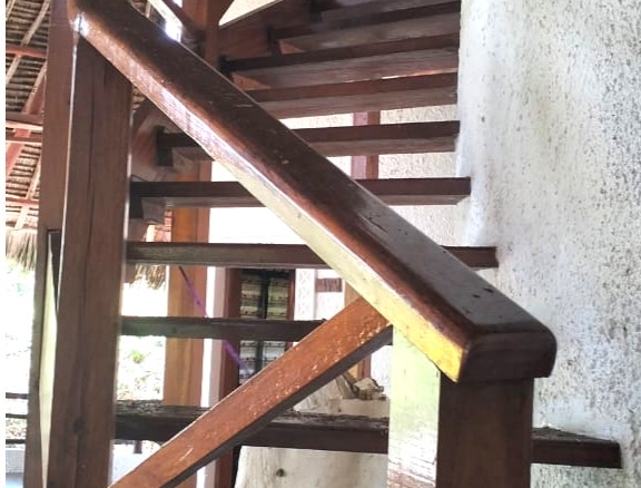 Luxury 4-bedroom house for sale in Mayungu, located in a secure gated community on the second row from the beach, featuring a shared swimming pool, landscaped garden, and serene coastal surroundings.
