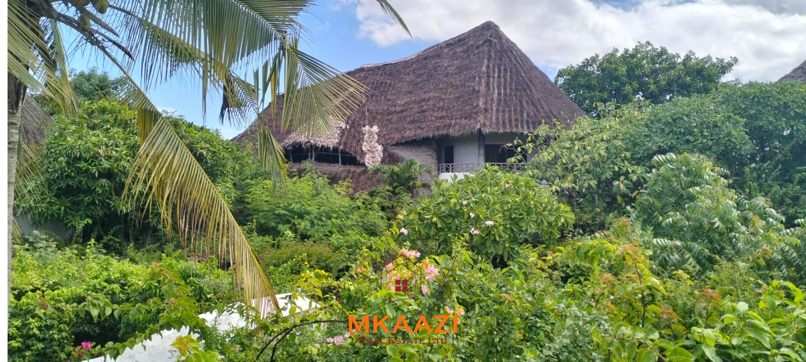 Luxury 4-bedroom house for sale in Mayungu, located in a secure gated community on the second row from the beach, featuring a shared swimming pool, landscaped garden, and serene coastal surroundings.