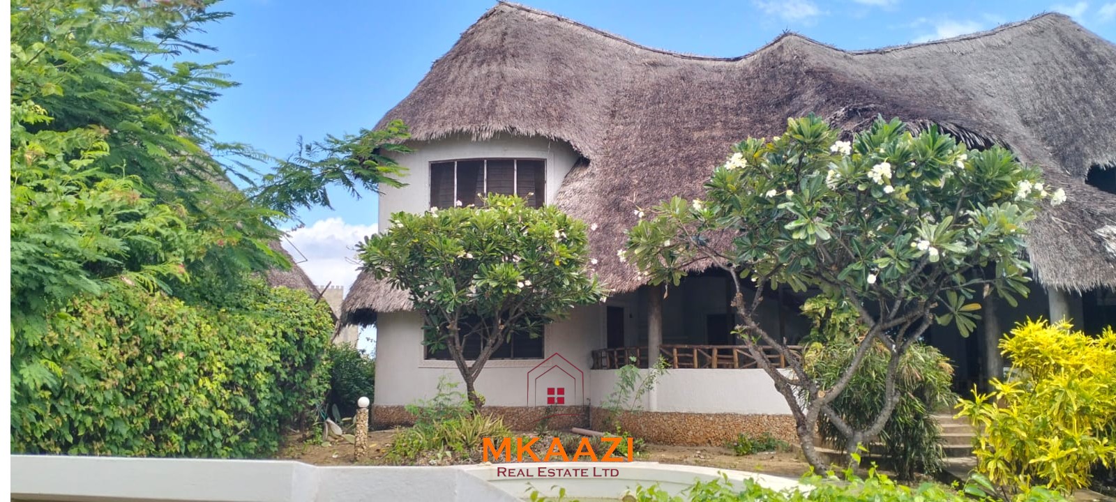 Luxury 4-bedroom house for sale in Mayungu, located in a secure gated community on the second row from the beach, featuring a shared swimming pool, landscaped garden, and serene coastal surroundings.