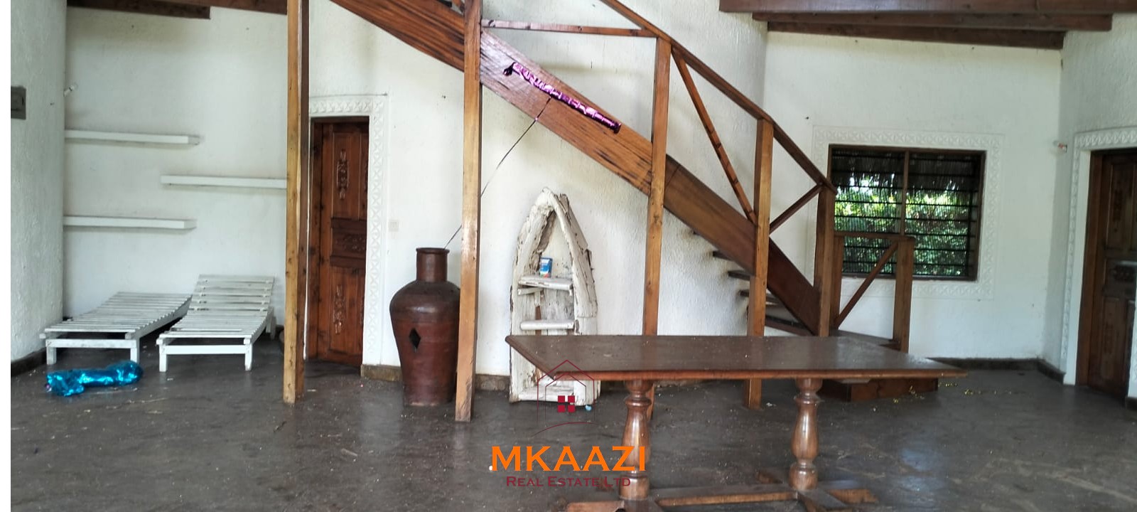 Luxury 4-bedroom house for sale in Mayungu, located in a secure gated community on the second row from the beach, featuring a shared swimming pool, landscaped garden, and serene coastal surroundings.