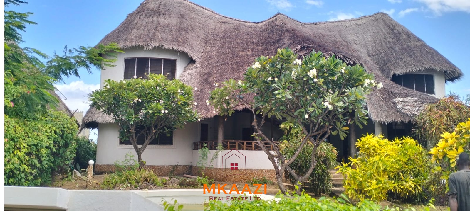 Luxury 4-bedroom house for sale in Mayungu, located in a secure gated community on the second row from the beach, featuring a shared swimming pool, landscaped garden, and serene coastal surroundings.