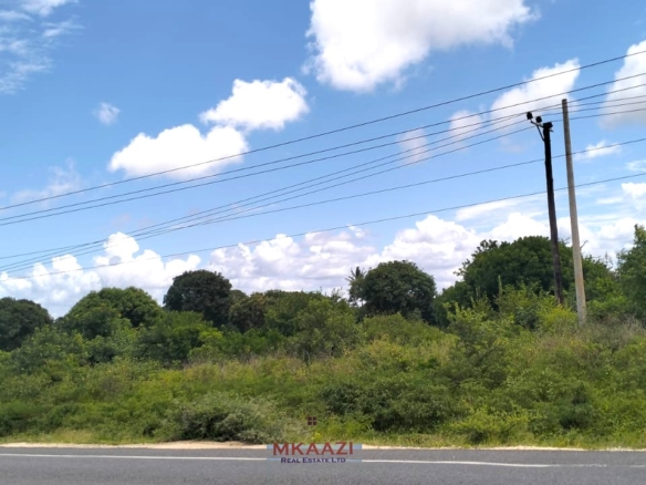 2-acre road frontage land for sale on Mombasa Road Kizingo with freehold title, power and water on site, ideal for commercial and mixed-use development.