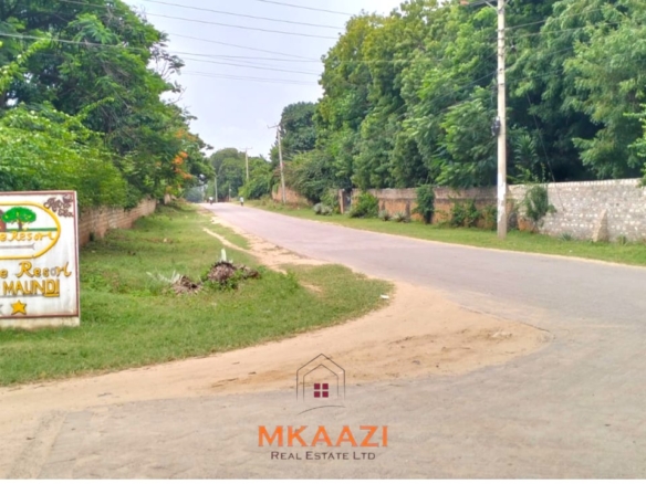 Quarter-acre plot for sale next to Mwembe Resort Malindi with ready title deed, perimeter wall, water and electricity on site.