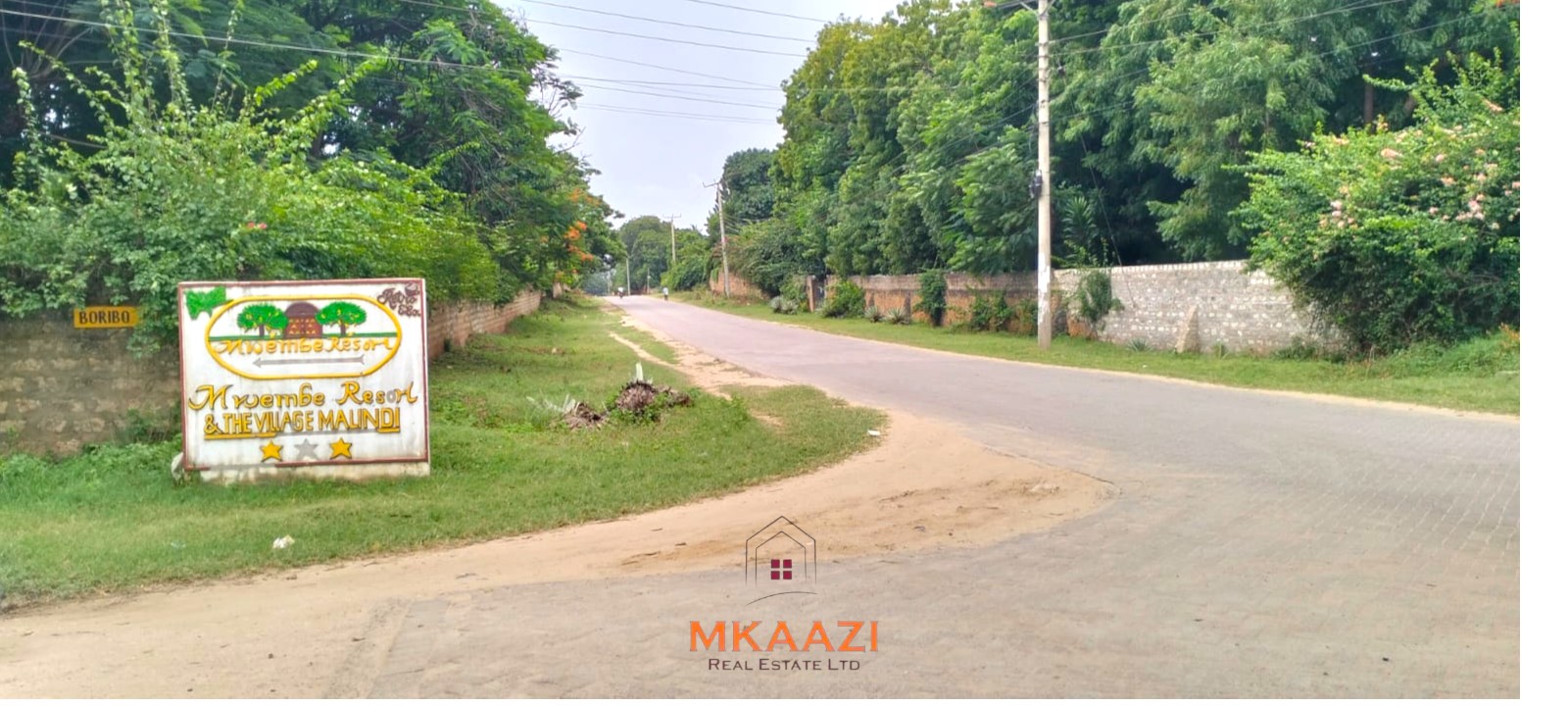 Quarter-acre plot for sale next to Mwembe Resort Malindi with ready title deed, perimeter wall, water and electricity on site.