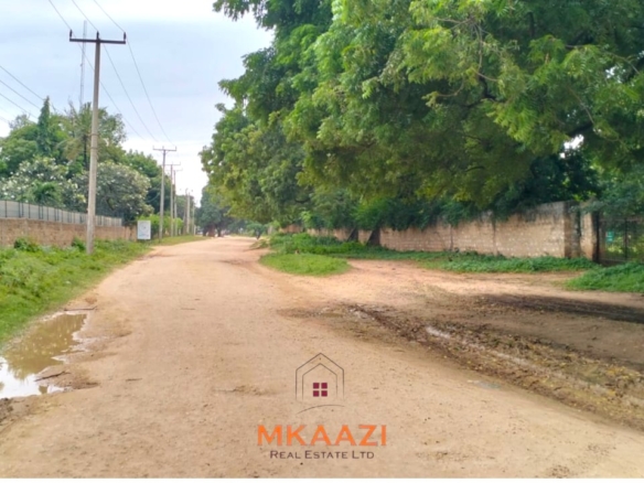 Quarter-acre plot for sale next to Mwembe Resort Malindi with ready title deed, perimeter wall, water and electricity on site.