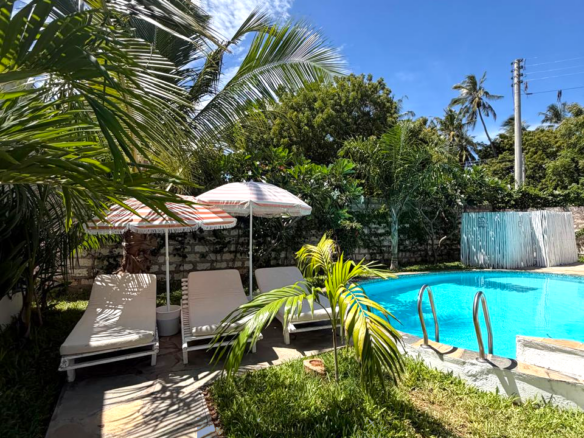 Luxury fully furnished twin villas for sale on Turtle Bay Road Watamu near Temple Point and LichtHaus featuring 4 bedrooms total, proven hospitality income, 70% occupancy rates, private terraces, DSQ, and strong ROI potential.