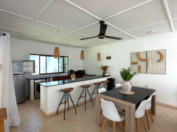 Luxury fully furnished twin villas for sale on Turtle Bay Road Watamu near Temple Point and LichtHaus featuring 4 bedrooms total, proven hospitality income, 70% occupancy rates, private terraces, DSQ, and strong ROI potential.
