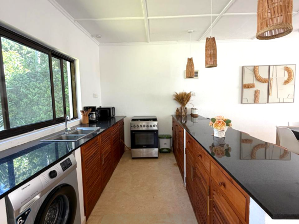 Luxury fully furnished twin villas for sale on Turtle Bay Road Watamu near Temple Point and LichtHaus featuring 4 bedrooms total, proven hospitality income, 70% occupancy rates, private terraces, DSQ, and strong ROI potential.