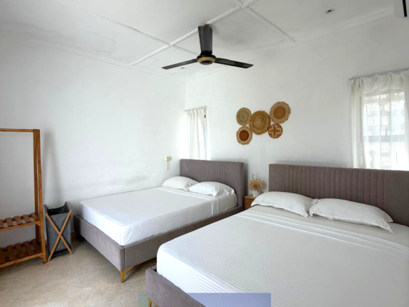 Luxury fully furnished twin villas for sale on Turtle Bay Road Watamu near Temple Point and LichtHaus featuring 4 bedrooms total, proven hospitality income, 70% occupancy rates, private terraces, DSQ, and strong ROI potential.