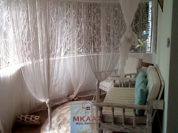 Fully furnished 2-bedroom luxury apartment for sale in Silver Rock Malindi along Casuarina Road featuring beach access, swimming pool, private garden, spacious rooms, porch, bathtub, and 24/7 security.