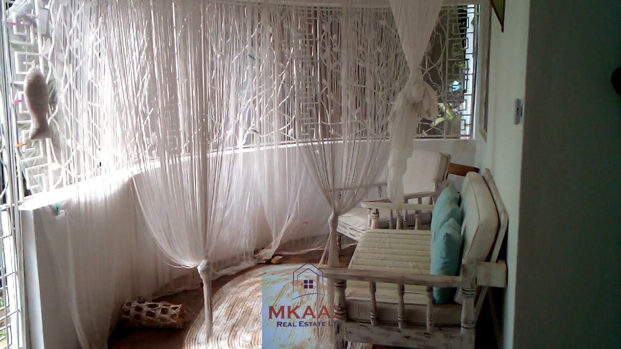 Fully furnished 2-bedroom luxury apartment for sale in Silver Rock Malindi along Casuarina Road featuring beach access, swimming pool, private garden, spacious rooms, porch, bathtub, and 24/7 security.