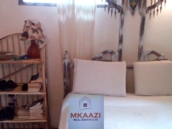 Fully furnished 2-bedroom luxury apartment for sale in Silver Rock Malindi along Casuarina Road featuring beach access, swimming pool, private garden, spacious rooms, porch, bathtub, and 24/7 security.