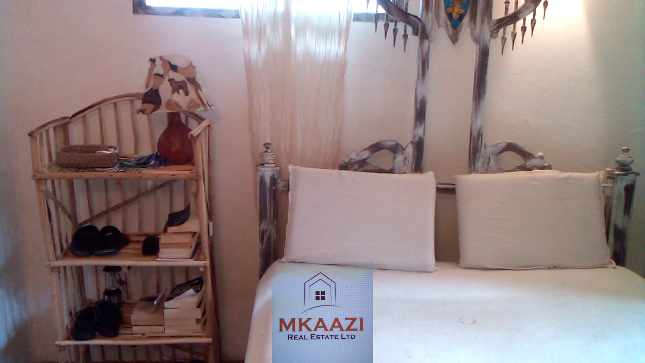 Fully furnished 2-bedroom luxury apartment for sale in Silver Rock Malindi along Casuarina Road featuring beach access, swimming pool, private garden, spacious rooms, porch, bathtub, and 24/7 security.