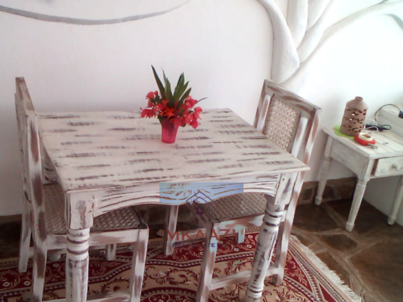 Fully furnished 2-bedroom luxury apartment for sale in Silver Rock Malindi along Casuarina Road featuring beach access, swimming pool, private garden, spacious rooms, porch, bathtub, and 24/7 security.