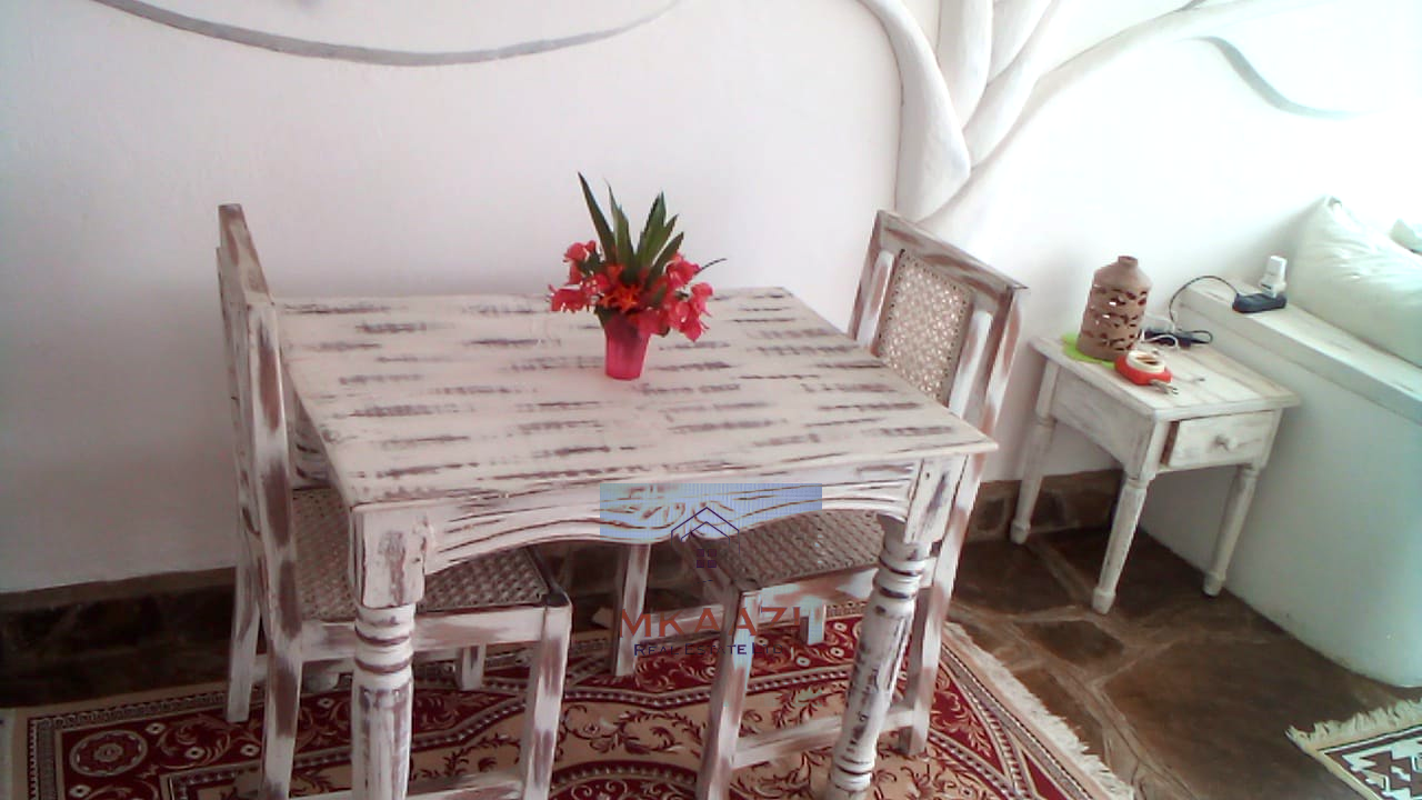 Fully furnished 2-bedroom luxury apartment for sale in Silver Rock Malindi along Casuarina Road featuring beach access, swimming pool, private garden, spacious rooms, porch, bathtub, and 24/7 security.