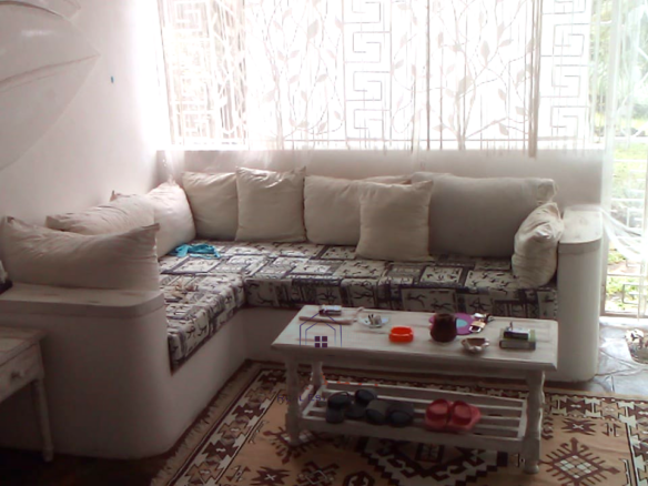Fully furnished 2-bedroom luxury apartment for sale in Silver Rock Malindi along Casuarina Road featuring beach access, swimming pool, private garden, spacious rooms, porch, bathtub, and 24/7 security.