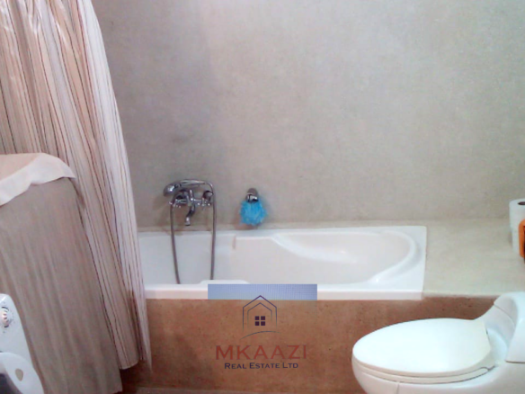 Fully furnished 2-bedroom luxury apartment for sale in Silver Rock Malindi along Casuarina Road featuring beach access, swimming pool, private garden, spacious rooms, porch, bathtub, and 24/7 security.