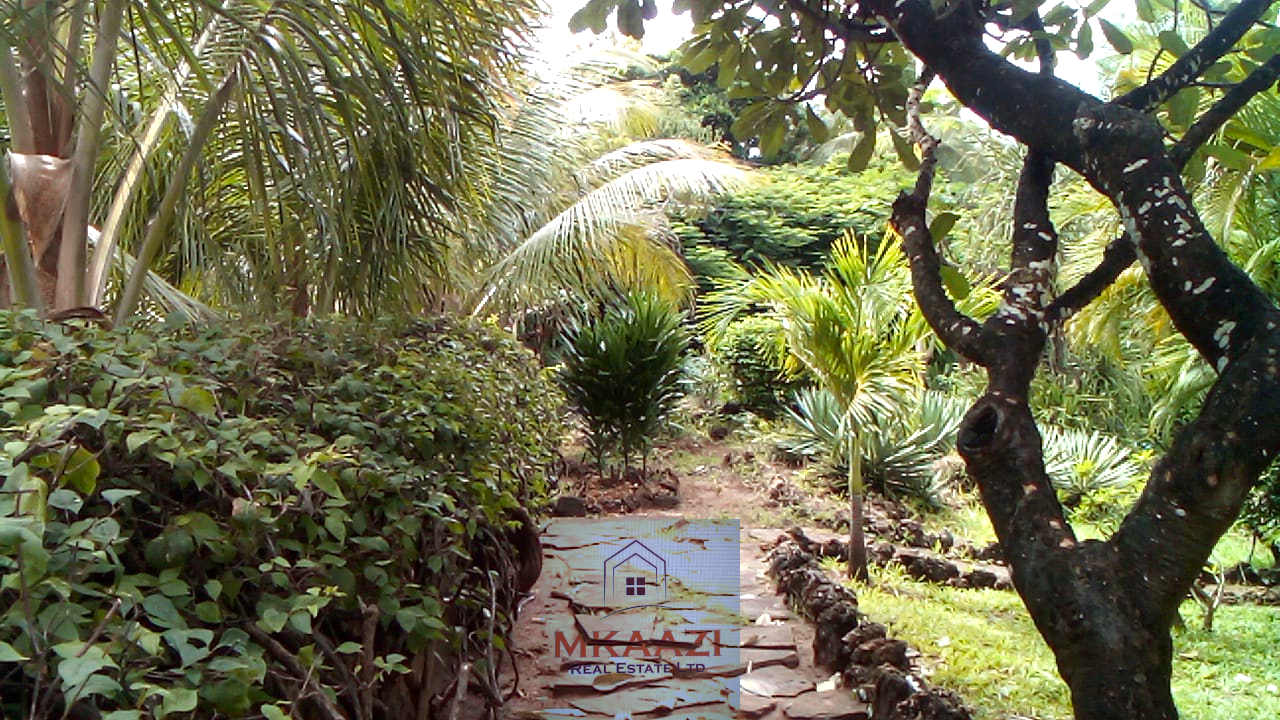 Fully furnished 2-bedroom luxury apartment for sale in Silver Rock Malindi along Casuarina Road featuring beach access, swimming pool, private garden, spacious rooms, porch, bathtub, and 24/7 security.