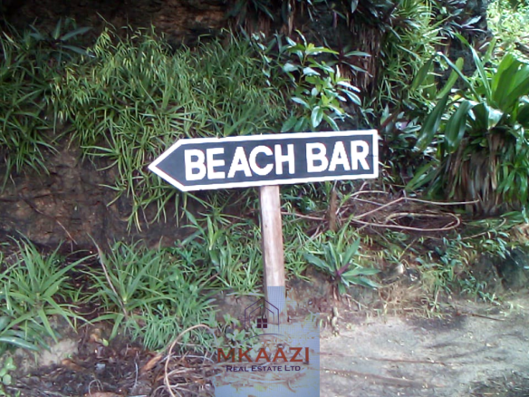 Fully furnished 2-bedroom luxury apartment for sale in Silver Rock Malindi along Casuarina Road featuring beach access, swimming pool, private garden, spacious rooms, porch, bathtub, and 24/7 security.