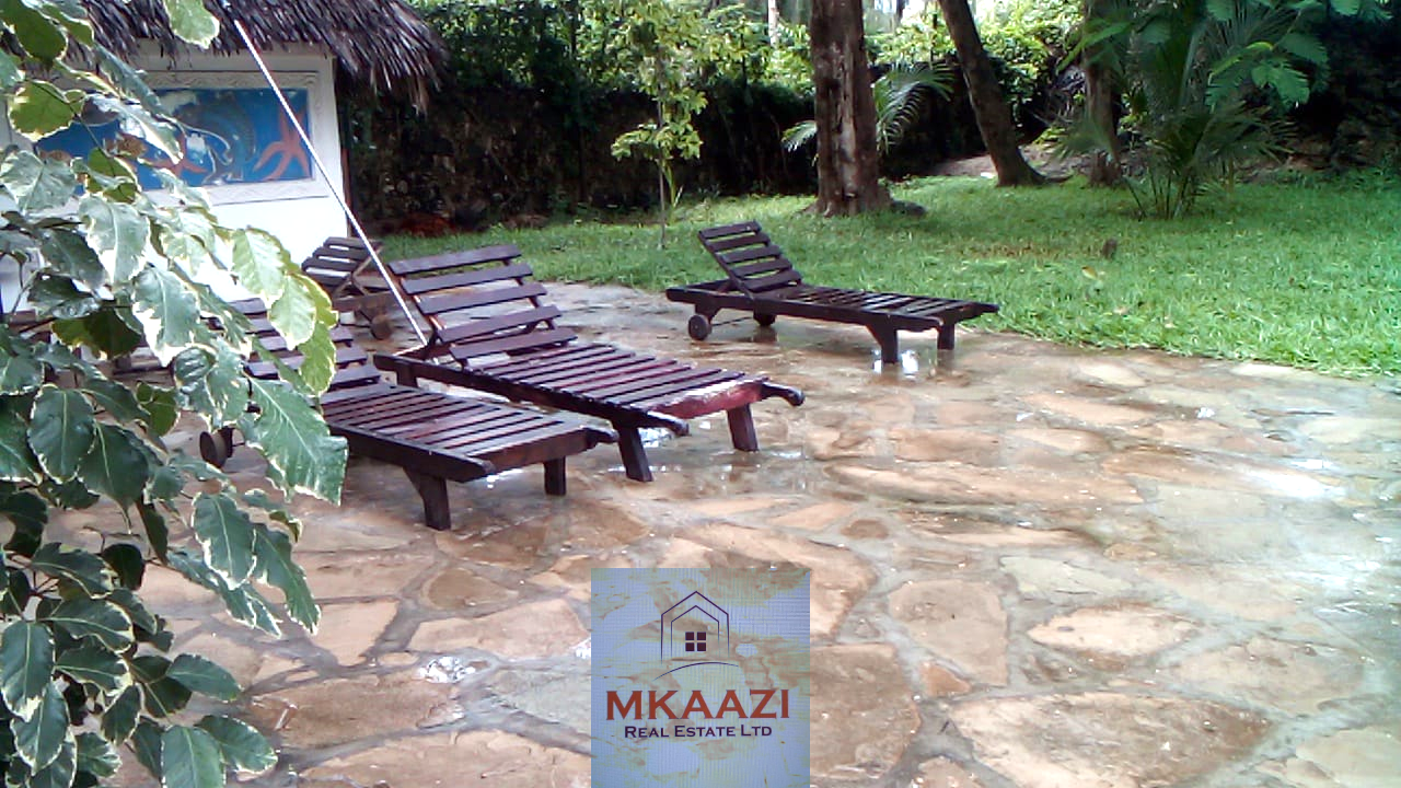 Fully furnished 2-bedroom luxury apartment for sale in Silver Rock Malindi along Casuarina Road featuring beach access, swimming pool, private garden, spacious rooms, porch, bathtub, and 24/7 security.